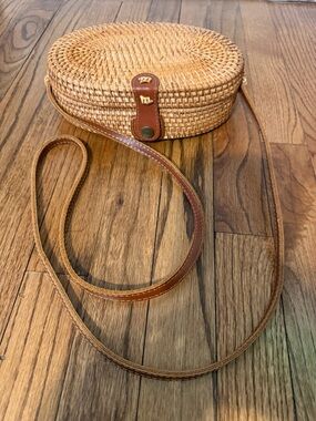 Woven Straw Oval Crossbody Bag with Brown Leather Trim